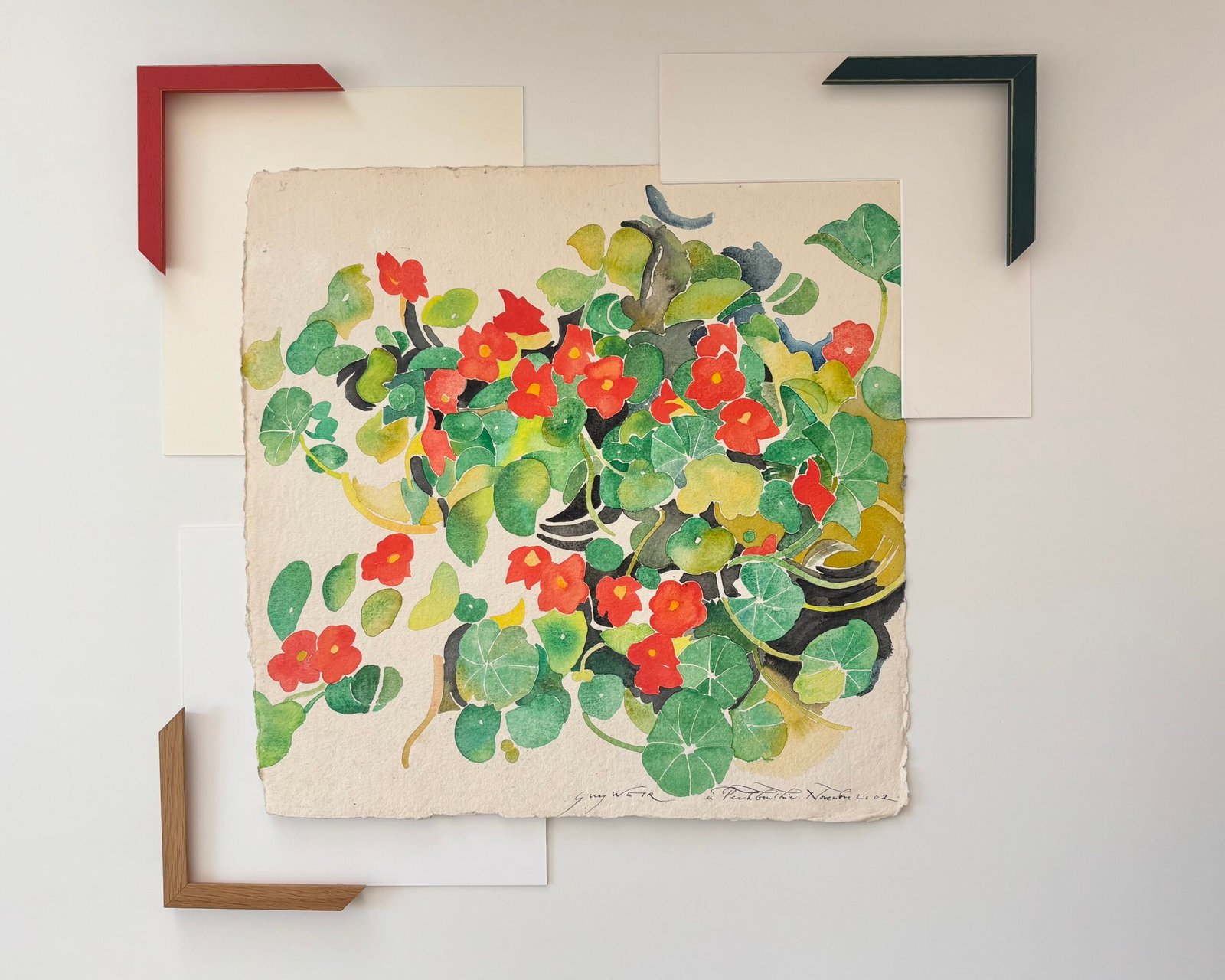 Essai de trois angles de baguette, rouge, vert et chêne sur une aquarelle fleurie de coquelicot